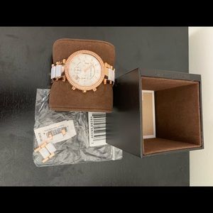 Michael Kors rose gold and white woman’s watch